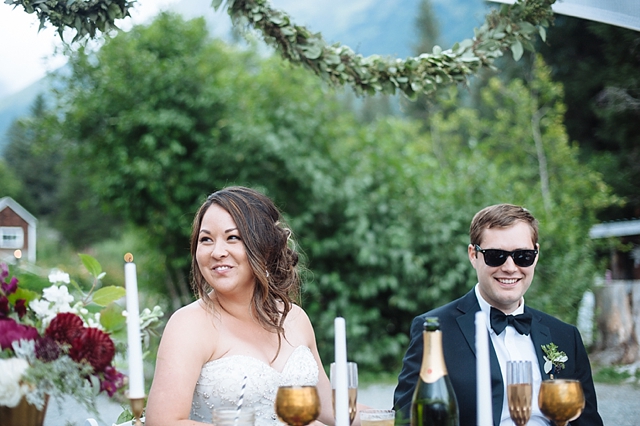 girdwood wedding photos with bride smiling at reception