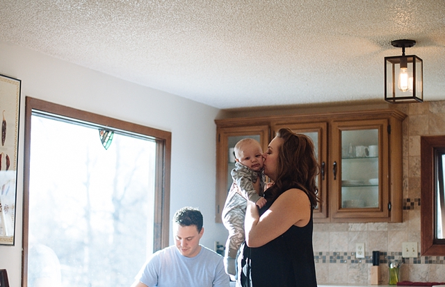 Anchorage family photography session with mom kissing baby