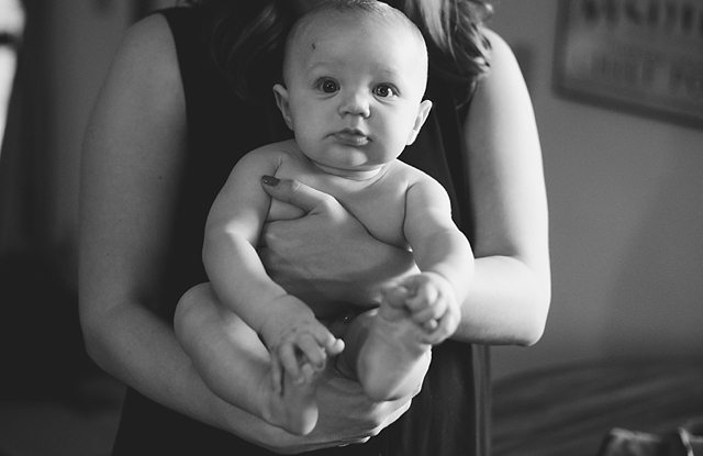 anchorage family photographers capture mom holding baby