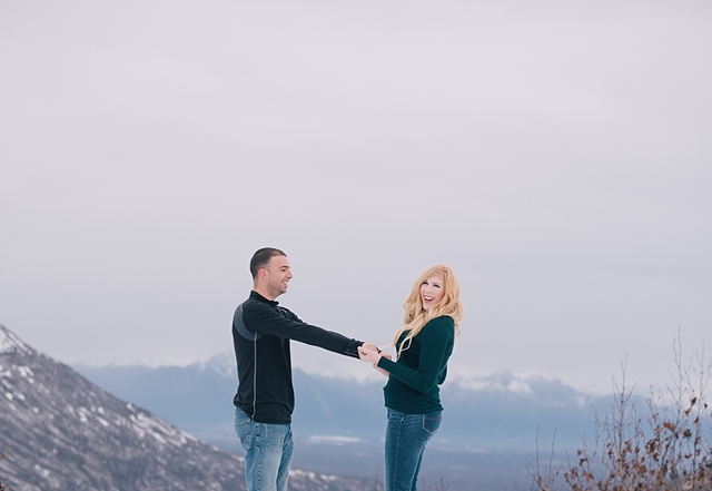 Hatcher Pass Winter Engagement Photos of playing in the snow