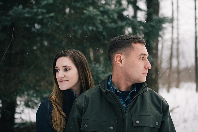 snowy alaska engagement photos in the forest
