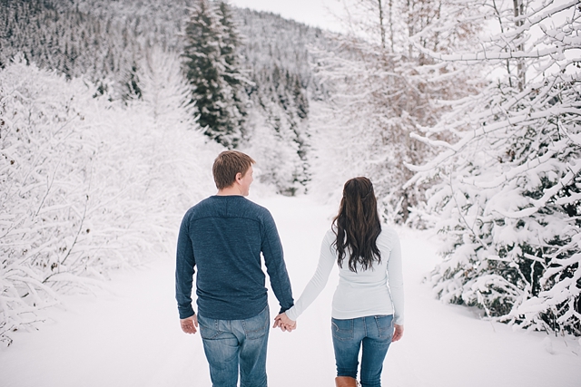 alaska winter engagement photos walking in the snow