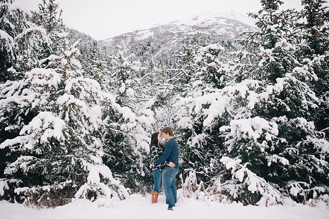 alaska winter engagement photos with snowy trees