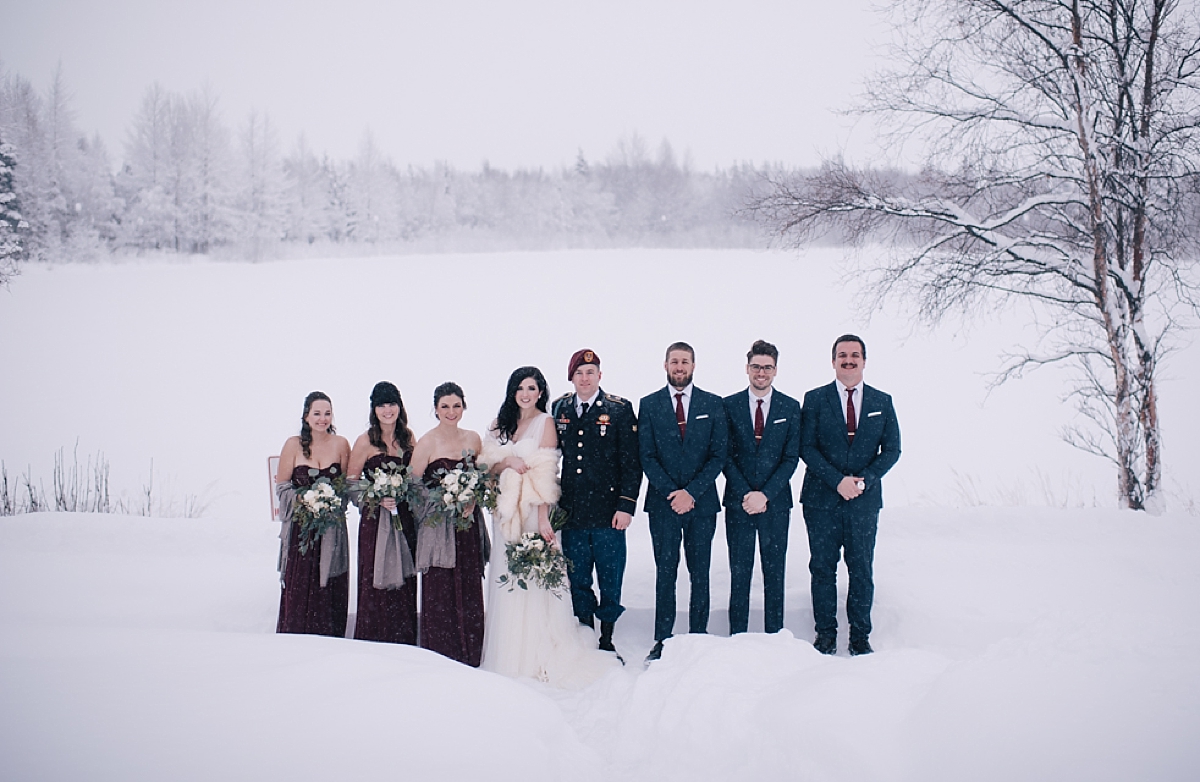 anchorage winter wedding party in the snow