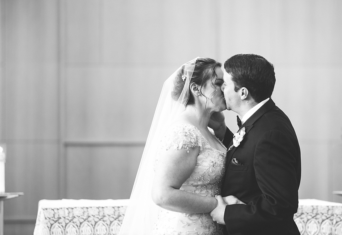 bride and groom first kiss alaska wedding